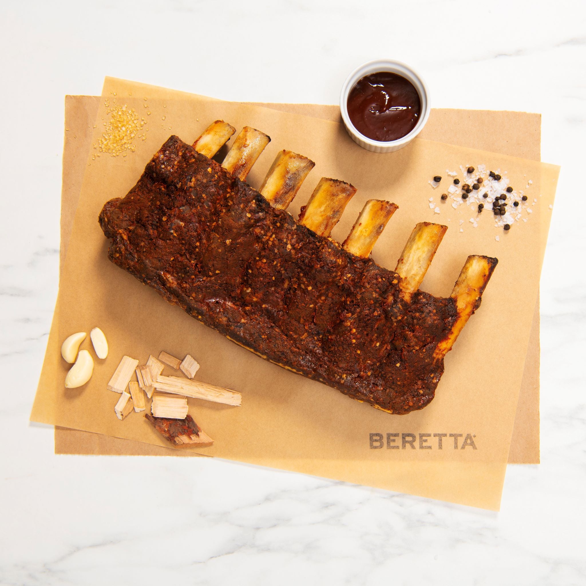 Rack of ribs with a side of sauce 