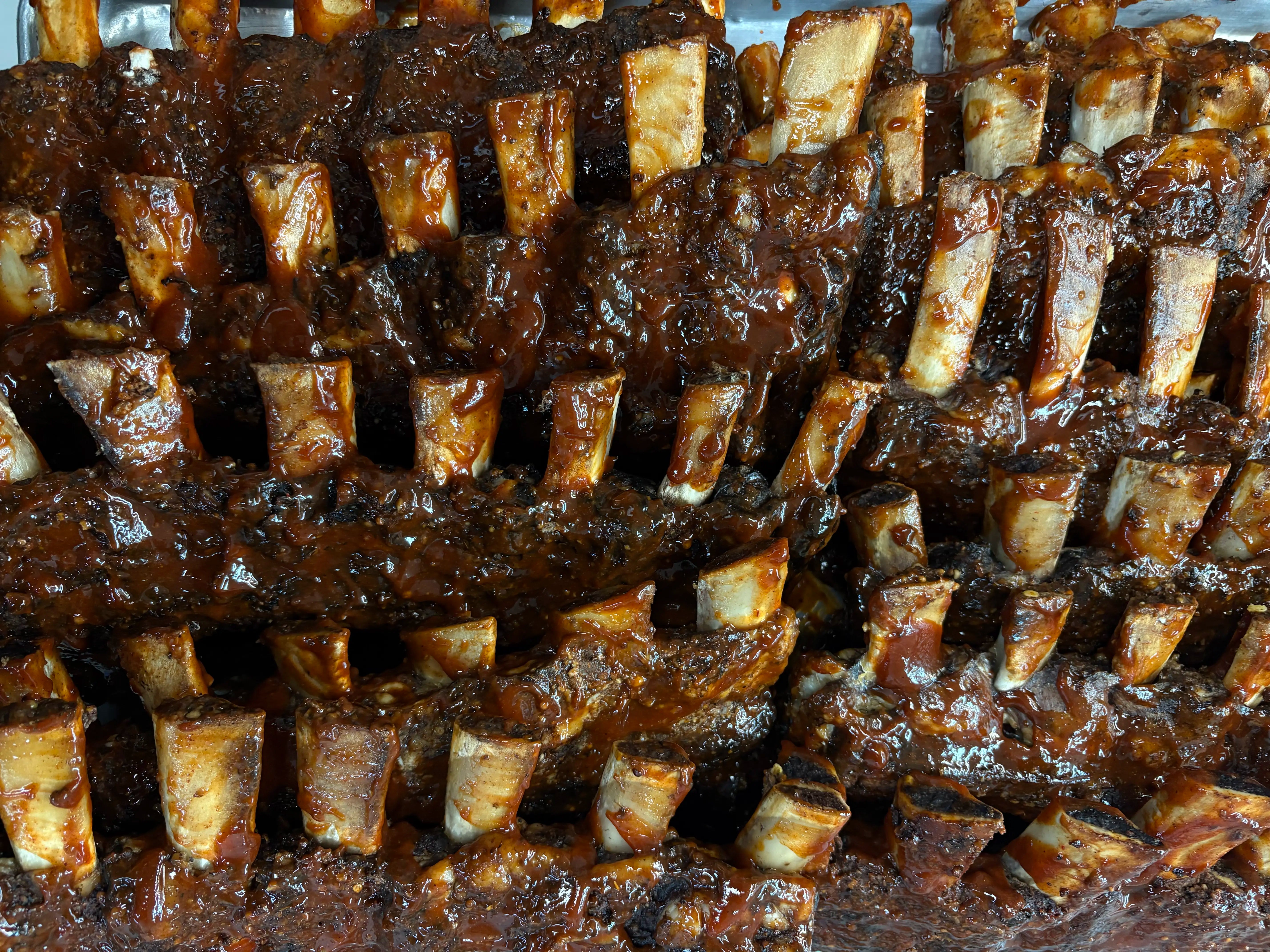 Rack of ribs with a side of sauce 