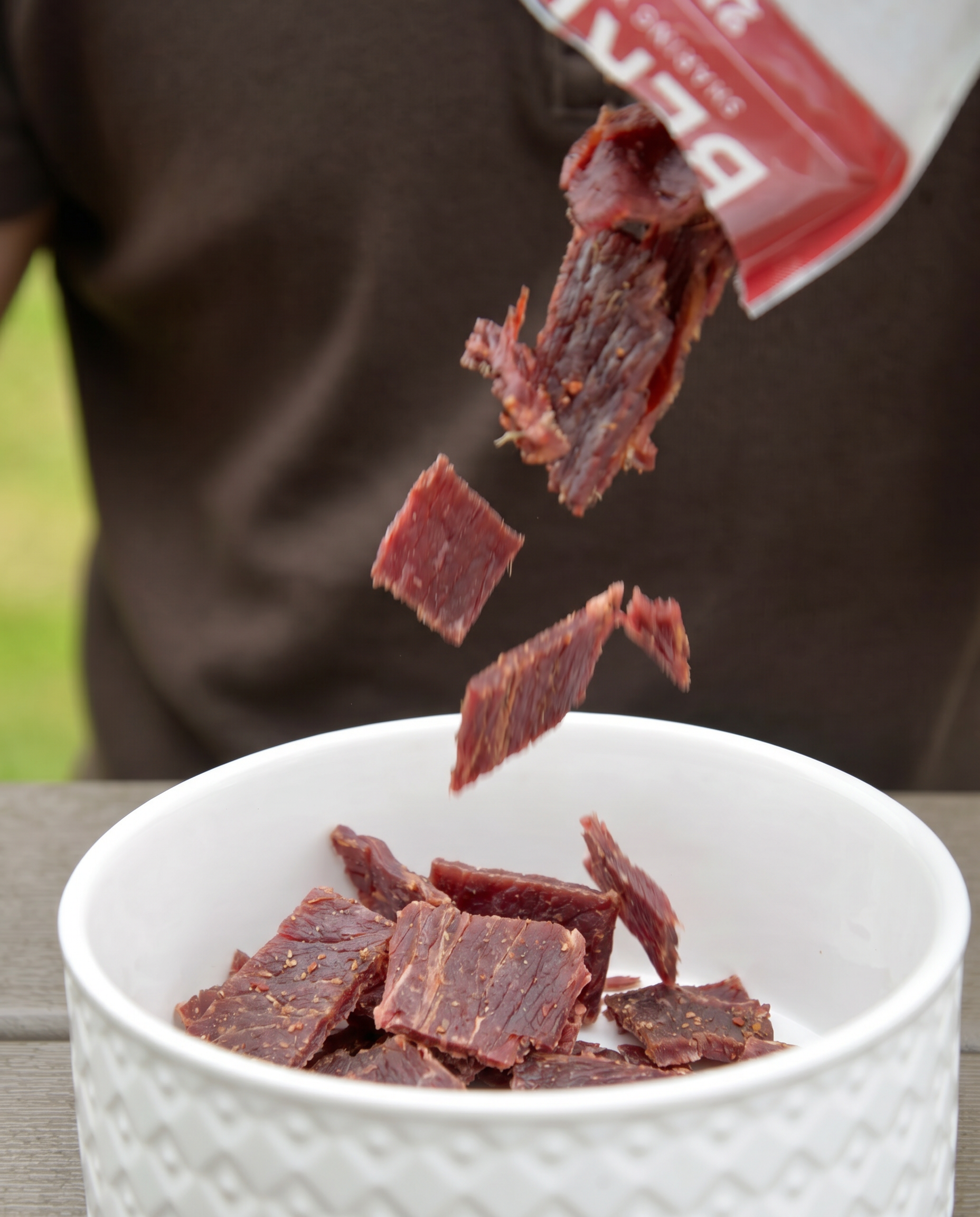 Beef Jerky going into a bowl