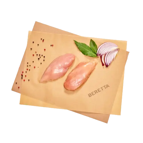 Organic chicken breasts on brown paper