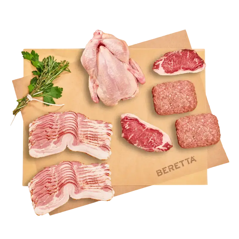 Organic meat delivery bundle with beef, chicken, pork and bison on brown paper